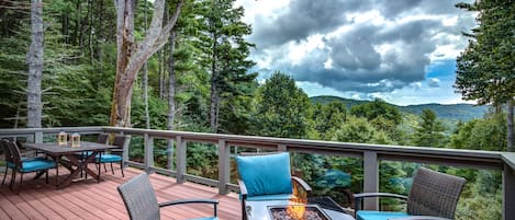 Outdoor deck with fire table, patio table and sectional seating (not shown).