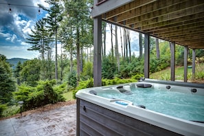 Brand new 7 person hot tub on lower level patio overlooking the mountains.