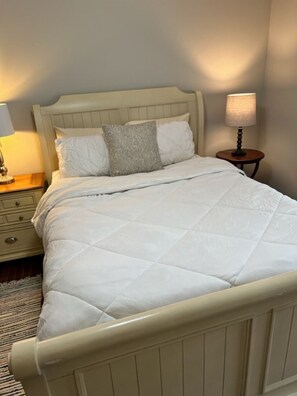 Queen bed, dresser/mirror, bedside tables, closet, heat/cool window unit.