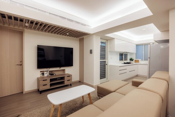 Comfy Living Room:
• 65” Smart TV 
• Open Space with Kitchen & Dining Area
