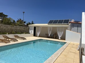 Pool area with dining outside