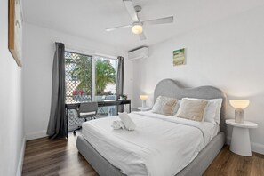The bedroom is fitted with Modern and comfy boucle Queen bed fitted with a luxurious foam mattress for a restful night’s sleep.
