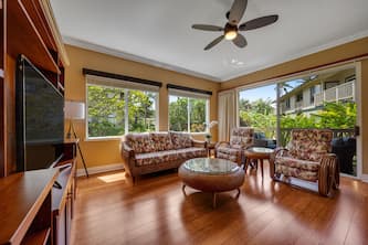 Palm-lined condo with easy beach access, pools, hot tubs, & tennis courts