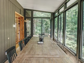 12 seat dining table looking over beautiful Sterling Forest, plus heated floors.