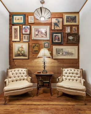 The pinterest-worthy gallery wall is complete with exposed original shiplap.