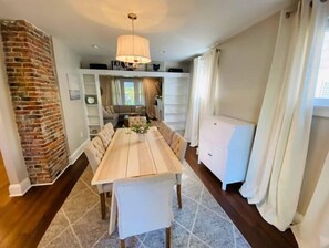 Dining room connected to living room and kitchen.