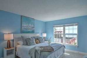 first bedroom has adjustable king bed and an ocean view w/private door to patio 