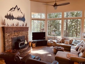Open family room with large windows and natural lighting.