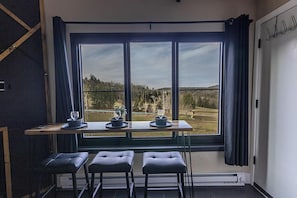 The additional eating area in the living room has great views of the slopes!