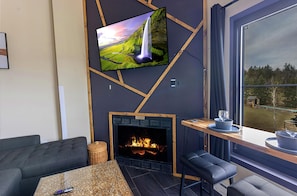 Enjoy the smart TV and the warmth of the electric fireplace with your nearest and dearest!