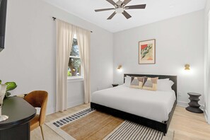 The master bedroom offers privacy, a king-sized bed, and private access to your en-suite bathroom—your perfect home base. - The Sandbar - Panama City Beach, FL