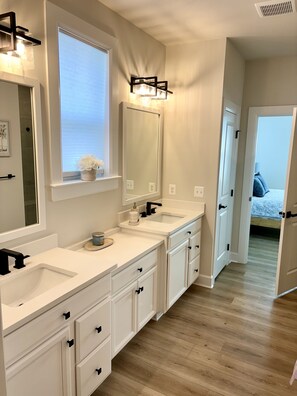 Dual vanity in the Master Bathroom. Check out the duel shower system.