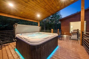 Back Deck—hot tub (fits 7 people) in covered area.