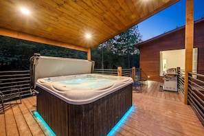 Back Deck—hot tub (fits 7 people) in covered area.