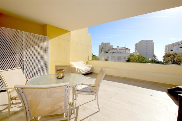 Large and sunny terrace with outdoor dining area and extra outdoor seating