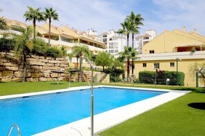 View of one of the two communal swimming pools in this complex