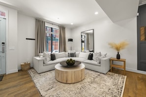 StayRepublic | Living Room w/ Smart TV (Plenty of Seating!) Open to Kitchen, Dining & Half Bathroom.