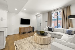 StayRepublic | Living Room w/ Smart TV (Plenty of Seating!) Open to Kitchen, Dining & Half Bathroom.