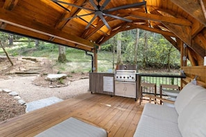 Deck with cozy couch and ceiling fan.  The best place for a nap . 