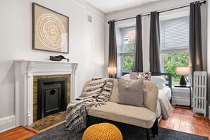 This charming and snug room includes an extra seat for added relaxation.