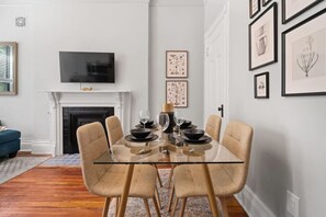 Gather 'round: Our dining area invites you to enjoy meals and make memories with comfortable seating for four.
