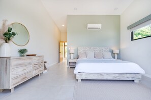 Rest easy in our minimalistic and spacious master bedroom, featuring a stunning view of Mar Vista mountains!