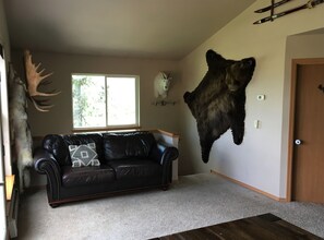 Spacious, open-concept living area showcasing some of Alaska's finest wildlife. 