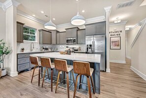 Chef-inspired Kitchen with large island and open to the family room. 