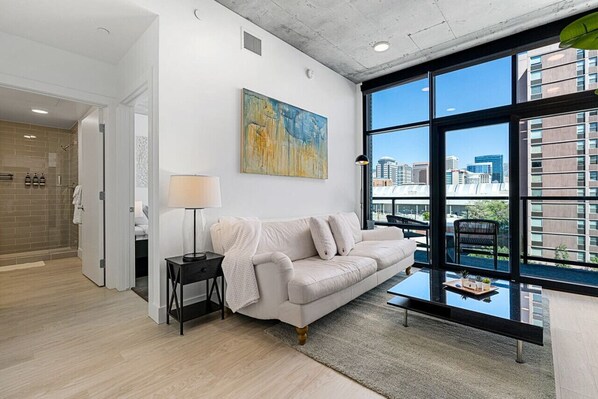 Luxury leather sofa and local art with a city view!