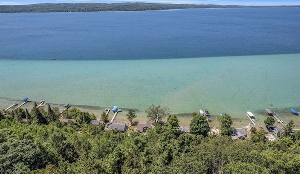 How many enchanting shades of blue and green can you spot? Immerse yourself in the beauty of Crystal Lake at its finest, and relish the splendor of this expansive 10,000-acre All-Sports Lake.