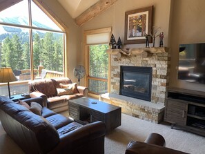 Beautifully appointed main living open to kitchen.  Warm fireplace keeps u cozy
