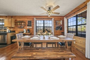 Large dining room room with additional chairs for the family to enjoy. 