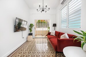 The living room offers a perfect blend of comfort, entertainment