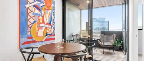 The light filled dining area with local Melbourne artwork