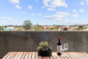 Enjoy a drink on your private balcony