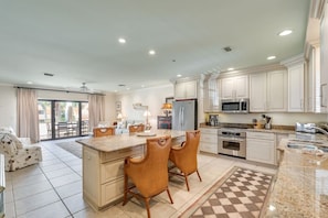 View of the kitchen, dining room and living area from the front door