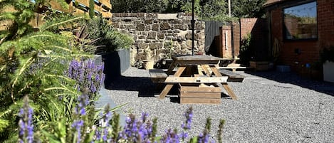 Pretty South Facing Courtyard with Seating for 4.