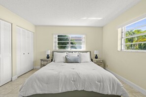 Second Bedroom, with large king bed, and spacious room! Closet and sliding doors to the patio!