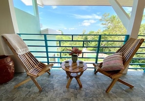 First floor terrace with patio furniture to enjoy the stunning jungle views
