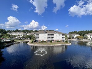 Enjoy the view overlooking the pond with a fountain from the balcony.