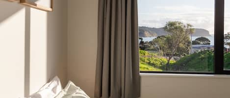 Primary bedroom with views of the Hokianga Harbour