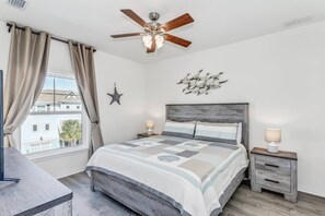 Master bedroom with king size bed and comfortable bedding