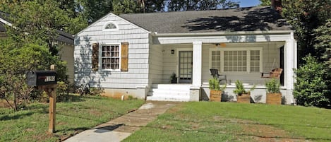 Front view, cozy white house and well maintained front-yard