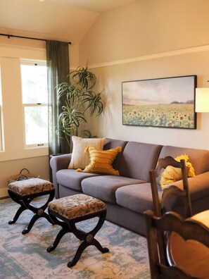 A sunlit room with charming decor and warm tones.