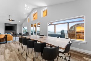 Take in the Lake views from the huge picturesque windows and custom live edge dining table