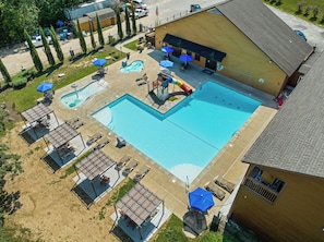 Enjoy the community amenities including pool, hot tub, kiddie pool, fire pit, and playground