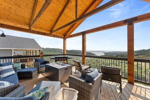 Plentiful seating, fire table, and Blackstone griddle are just a few of the features on the back deck