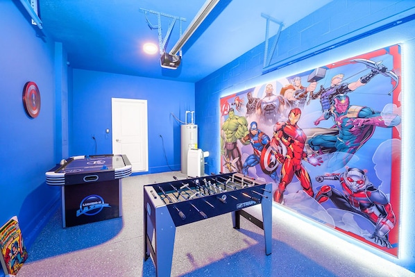 Garage-turned-games-room with air hockey and foosball