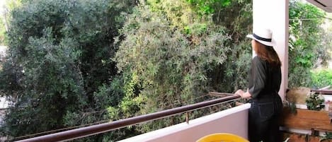 Relax in the private balcony gazing upon the olive grove