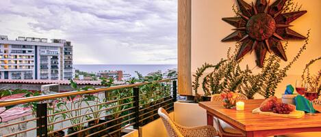 Breathtaking views to the ocean and mountains from the private balcony